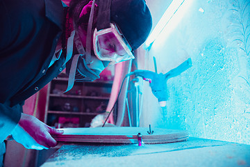 Image showing Skater in process of making his own skateboard, longboard - open business concept