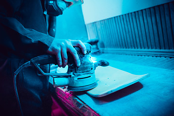 Image showing Skater in process of making his own skateboard, longboard - open business concept