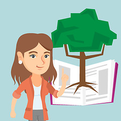 Image showing Caucasian student pointing at tree of knowledge.