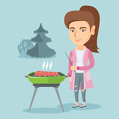 Image showing Caucasian woman cooking steak on the barbecue.