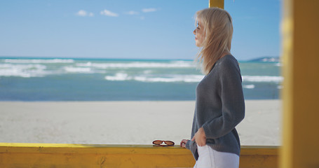 Image showing Young woman enjoying the warm autumn day