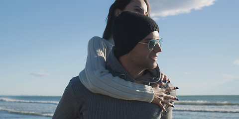 Image showing couple having fun at beach during autumn