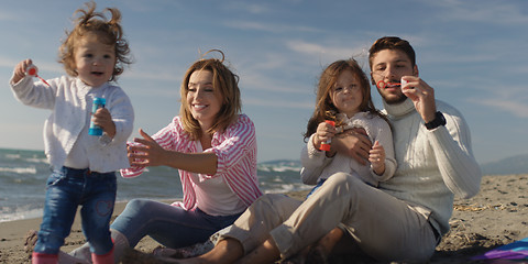 Image showing Young family enjoying vecation during autumn