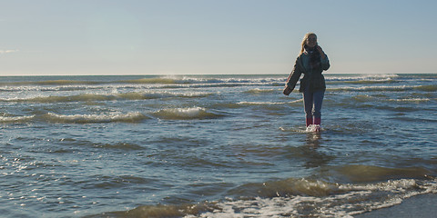 Image showing Young woman enjoying the warm autumn day