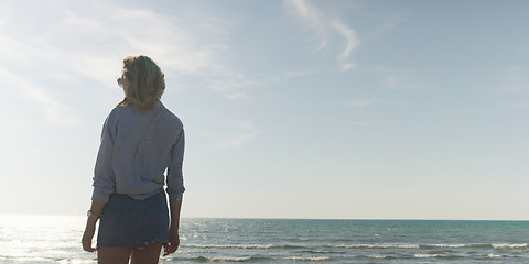 Image showing Young woman enjoying the warm autumn day