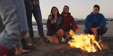 Image showing Friends having fun at beach on autumn day