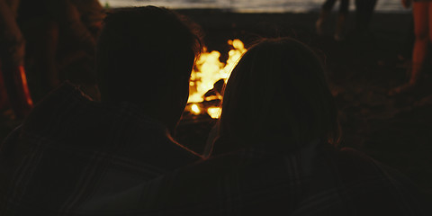 Image showing Couple enjoying with friends at night on the beach