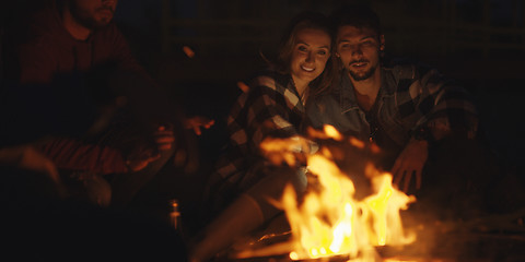 Image showing Couple enjoying with friends at night on the beach