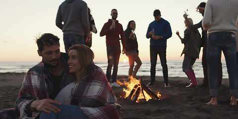 Image showing Friends having fun at beach on autumn day