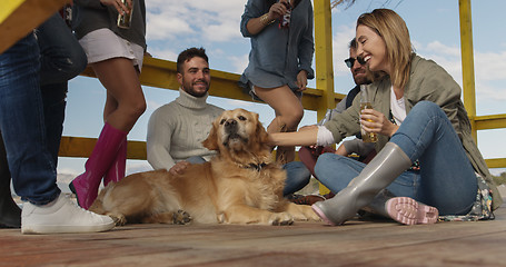 Image showing Group of friends having fun on autumn day at beach