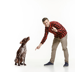 Image showing Emotional Portrait of a man and his dog, concept of friendship and care of man and animal