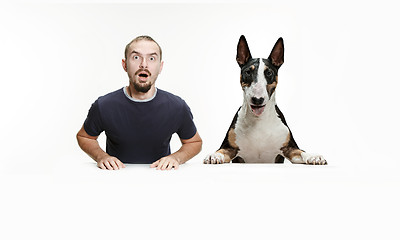 Image showing Emotional Portrait of a man and his shepherd dog, concept of friendship and care of man and animal