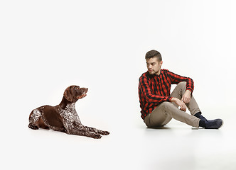 Image showing Emotional Portrait of a man and his dog, concept of friendship and care of man and animal