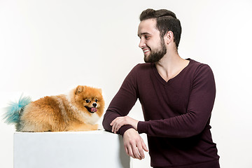 Image showing Emotional Portrait of a man and his dog, concept of friendship and care of man and animal