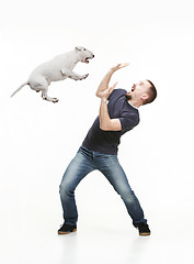 Image showing Emotional Portrait of a man and his Bull Terrier dog, concept of friendship and care of man and animal