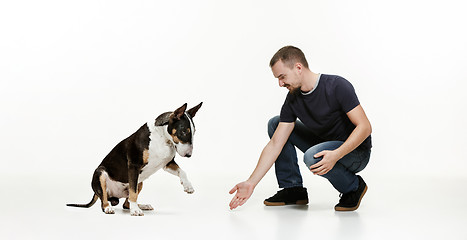 Image showing Emotional Portrait of a man and his shepherd dog, concept of friendship and care of man and animal