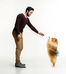 Image showing Emotional Portrait of a man and his dog, concept of friendship and care of man and animal