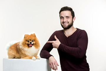 Image showing Emotional Portrait of a man and his dog, concept of friendship and care of man and animal