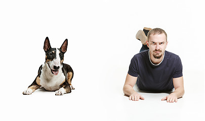 Image showing Emotional Portrait of a man and his shepherd dog, concept of friendship and care of man and animal