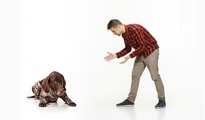 Image showing Emotional Portrait of a man and his dog, concept of friendship and care of man and animal