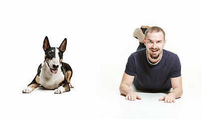 Image showing Emotional Portrait of a man and his shepherd dog, concept of friendship and care of man and animal