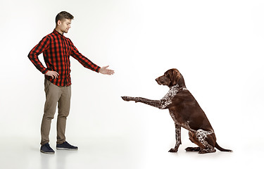 Image showing Emotional Portrait of a man and his dog, concept of friendship and care of man and animal