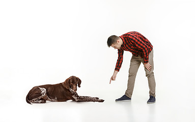 Image showing Emotional Portrait of a man and his dog, concept of friendship and care of man and animal