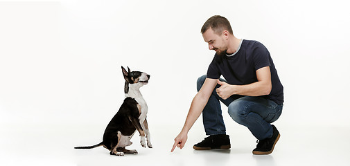 Image showing Emotional Portrait of a man and his shepherd dog, concept of friendship and care of man and animal