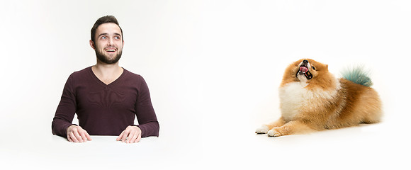 Image showing Emotional Portrait of a man and his dog, concept of friendship and care of man and animal