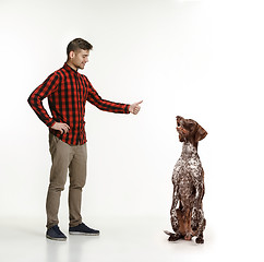 Image showing Emotional Portrait of a man and his dog, concept of friendship and care of man and animal