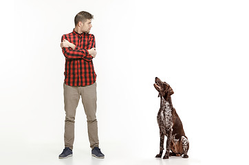 Image showing Emotional Portrait of a man and his dog, concept of friendship and care of man and animal