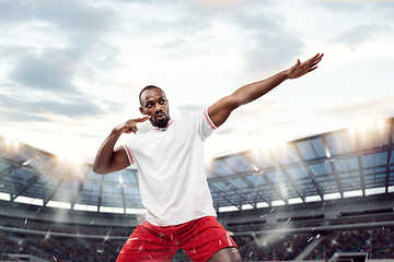 Image showing The football player in motion on the field of stadium