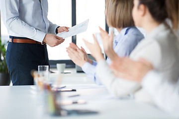 Image showing business team at office meeting or presentation