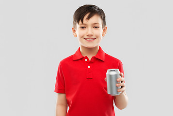 Image showing boy in red t-shirt drinking soda from tin can