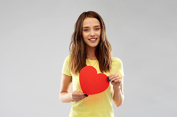 Image showing smiling teenage girl with red heart