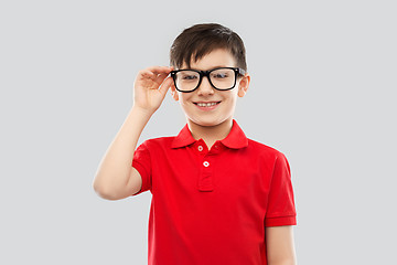 Image showing portrait of smiling boy in glasses and red t-shirt