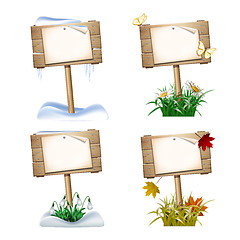 Image showing Set of wooden signs in four seasons.