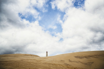 Image showing Lighthouse tower rising up on a dune beach