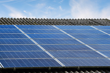 Image showing Sun panels on a roof in bright daylight