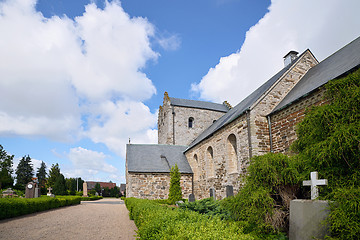 Image showing Tombstone with a cross in front of a church