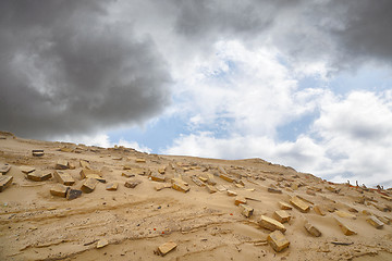 Image showing Bricks in the sand left remains of a building