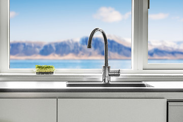 Image showing Kitchen sink by a window with a view
