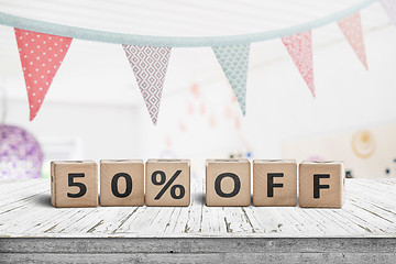 Image showing Special price 50 percent off promotion sign