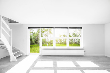 Image showing Bright living room with a view to a green garden