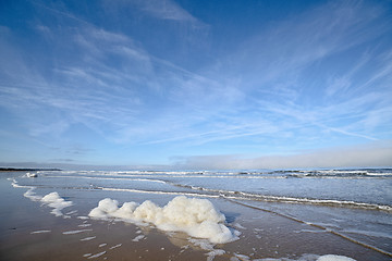 Image showing Foam on the beach by the ocean