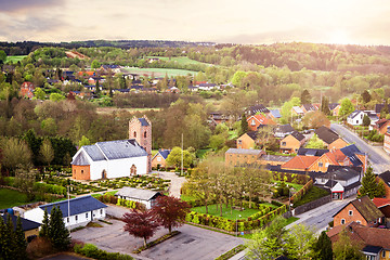 Image showing Village with a church in the morning sunrise