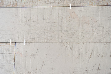 Image showing Ceramic wood effect tiles and tools for tiler on the floor