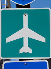 Image showing Green and white airport road sign on pole