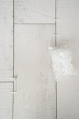 Image showing Ceramic wood effect tiles and tools for tiler on the floor