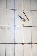 Image showing Ceramic tiles and tools for tiler